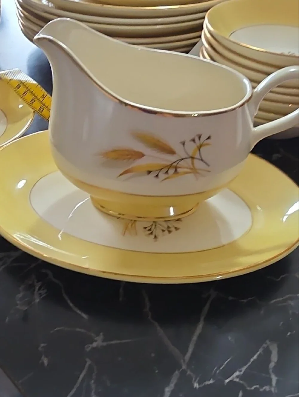 Yellow and White Floral Dinnerware with Gold Trim Accents